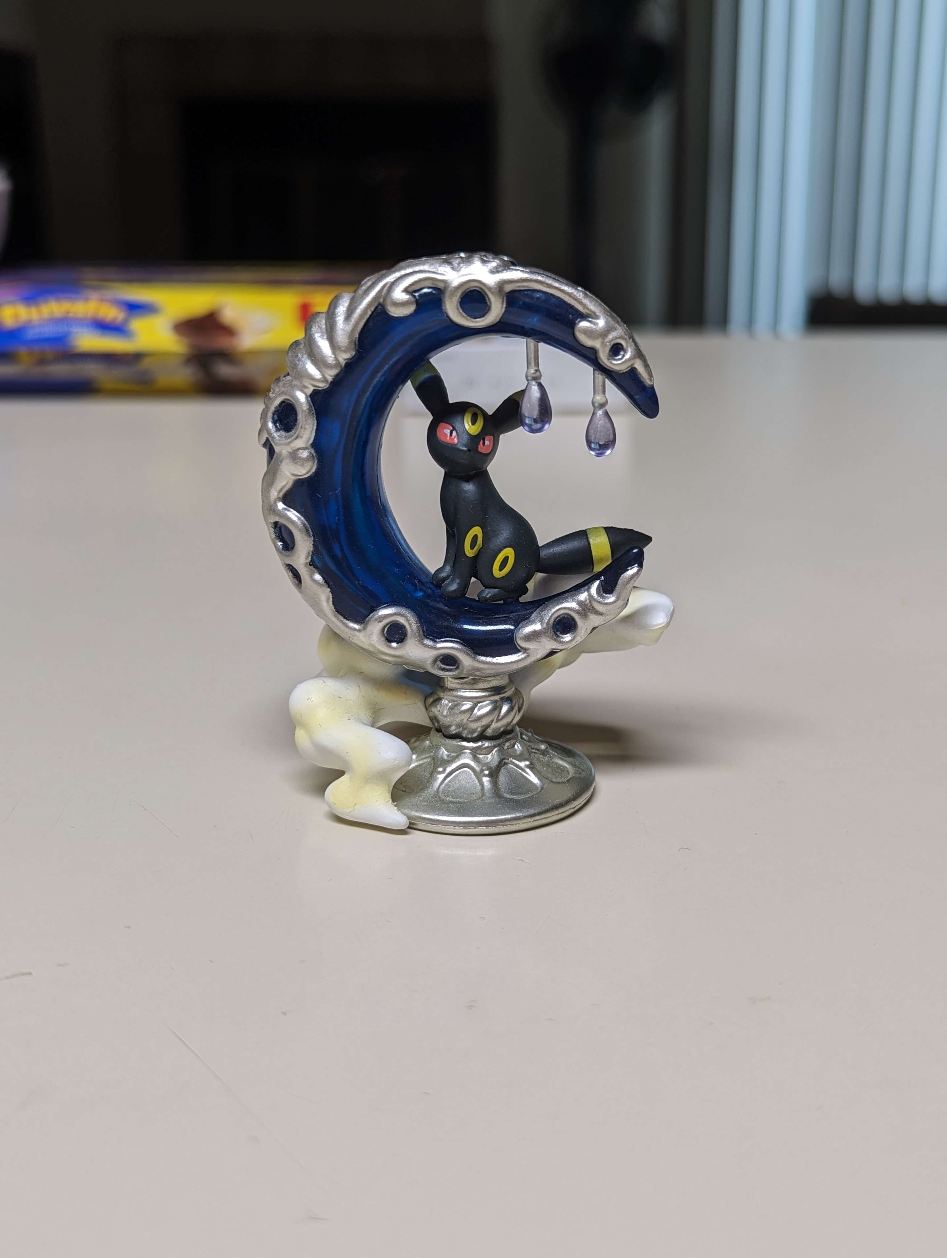 Umbreon figure on a moon
